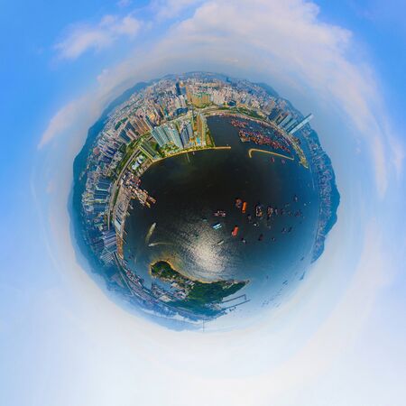 Little planet 360 degree sphere birds eye view. Panoramic view of aerial view of Hong Kong Downtown. Financial district and business centers in technology smart city. Skyscraper buildings at noon.の写真素材