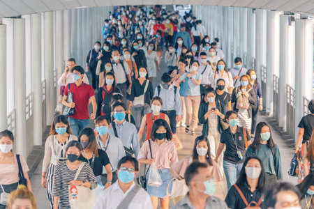 Bangkok City, Thailand : 03/12/2020 : Unidentified people, Crowd of Thai wearing face mask for health due to Coronavirus Disease or covid-19 and air pollution in mass transit in public. Rush hour.のeditorial素材