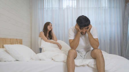 Frustrated angry Asian girlfriend dissatisfy or fight with her boyfriend, young couple in...