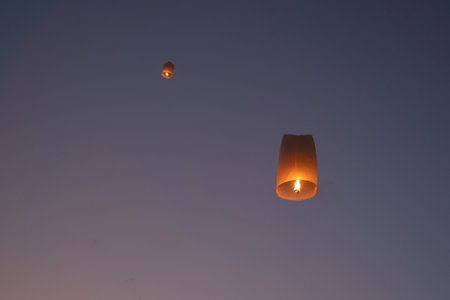 Thai people release sky floating lanterns or lamp to worship Buddha's relics at night. Traditional festival in Chiang mai, Thailand. Loy krathongの写真素材