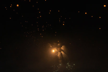 Thai people release sky floating lanterns or lamp to worship Buddha's relics at night. Traditional festival in Chiang mai, Thailand. Loy krathongの写真素材