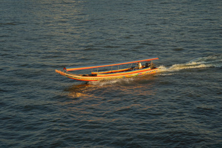A cruising boat or small vessel on Chao Phraya River in Bangkok City, Thailand