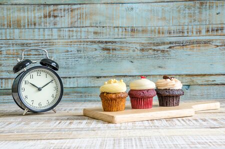 cupcake on wooden table on vintage backgroundの写真素材