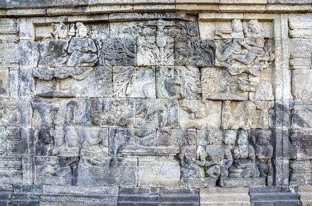 Ancient stone sculptures on the wall in the Borobudur temple in Yogyakarta, Java, Indonesia. のeditorial素材