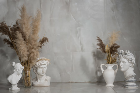 Classical Busts and Pampas Grass Decor Arrangementの写真素材