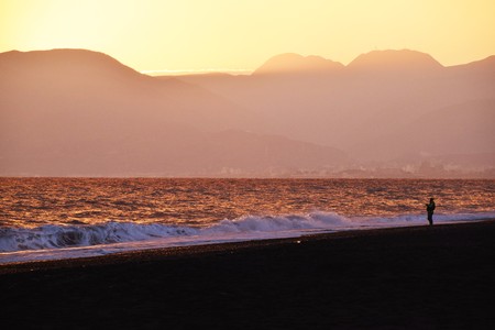 Winter beach fishermanの写真素材