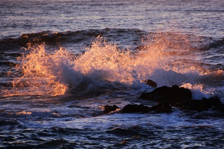 Wave splash is glowing in the surfaceの写真素材