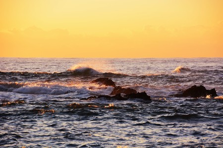Wave splash is glowing in the surfaceの写真素材
