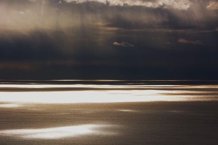 Reflection on the surface of the sea at dawnの写真素材