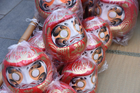 Daruma doll market and festival. Daruma is loved by Japanese as a talisman. It is considered a symbol of perseverance because Daruma always comes upright position every time after it tumbles.の写真素材
