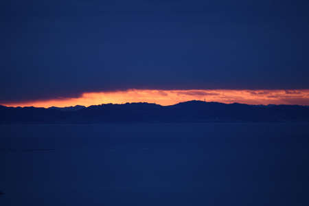 A view of the brilliance of the sunrise and the reflection of the sea surface. The moment when...