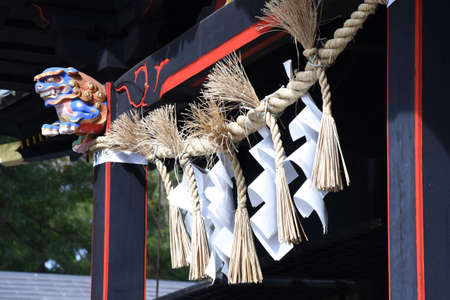 The culture and tradition of Japanese shrines Shimenawa. Shimenawa is a sacred rope of ric-straw.It separetes a holy place from other unclean places and is concidered a barrier against evil sprits.の写真素材
