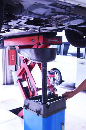 A scene of regular inspection and maintenance work on the car.の写真素材