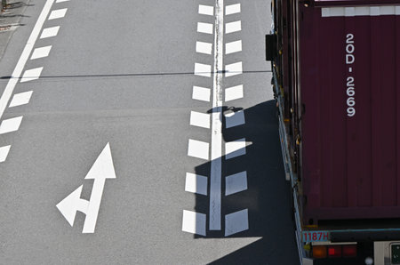 Japanese road traffic signs. Various signs are written on the road for traffic safety. Also, like in the UK, Japanese vehicles drive on the left.の写真素材