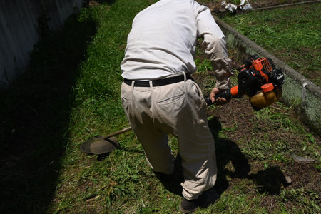 A scene from weed cutting work. Background material for working people.