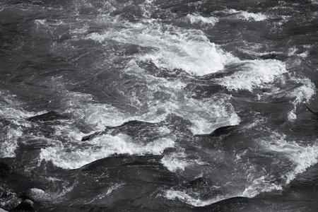 A scene of splashing water in the river. Background material of the flow of river water.