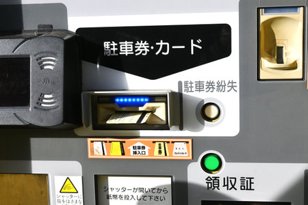 A scene of a paid parking lot for cars in Japan. The parking lot's automatic gate system.の写真素材