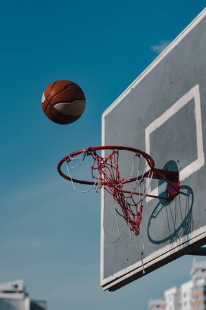 basketball hoop against blue skyの写真素材