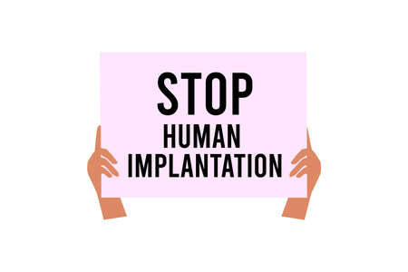 A man holds a placard with the inscription. Stop human implantation. A protest against the...
