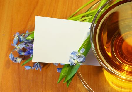 Tea and  bouquet of blue flowers の写真素材