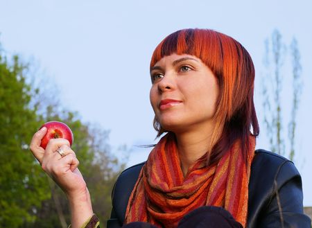 The beautiful young girl and red appleの写真素材