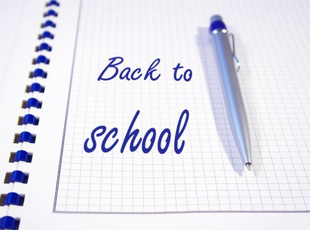 One silver pen and spiral notebook closeupの写真素材