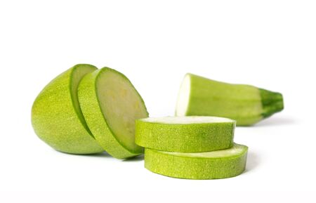 Raw cut zucchini isolated on white backgroundの写真素材