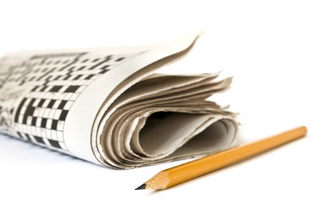 Crossword and pencil isolated on white backgroundの写真素材