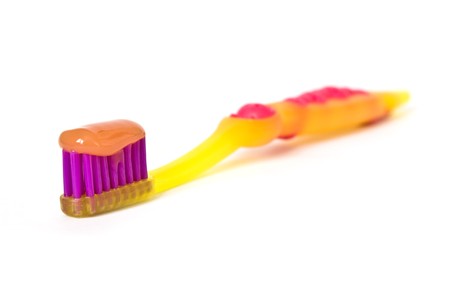 Bicolor toothbrush isolated on a white backgroundの写真素材