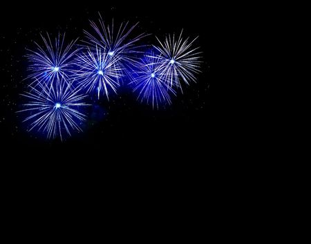 Blue fireworks explosion on a black backgroundの写真素材