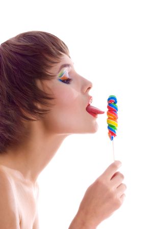 Cute woman with bright candy. Studio shotの写真素材