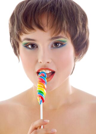 Cute woman with bright candy. Studio shotの写真素材