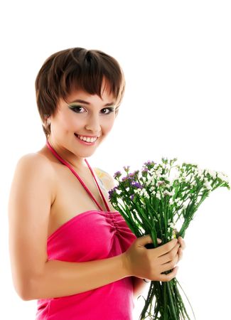 Cute young woman with bouquet of wild flowersの写真素材