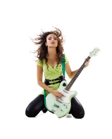 Cute women with electric guitar. Studio isolatedの写真素材