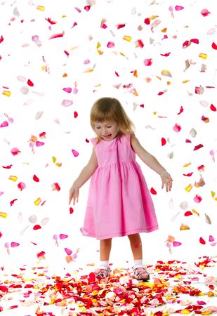 Ctue little girl and rose petals. Studio shotの写真素材