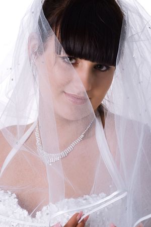Pretty bride in a white dress. Studio shotの写真素材