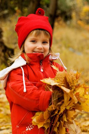 Autumn portrait of cute little caucasian girl の写真素材