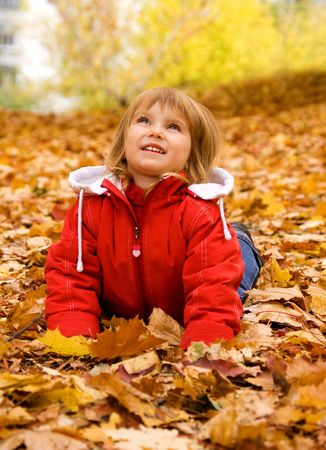Autumn portrait of cute little caucasian girl の写真素材