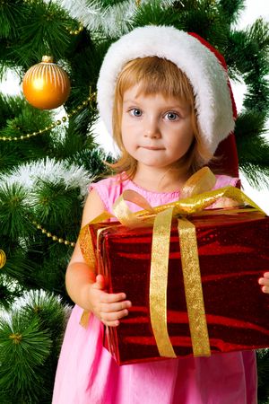 Cute girl with xmas gifts. Isolated on witeの写真素材