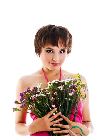 Cute young woman with bouquet of wild flowersの写真素材