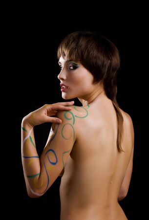 Model isolated on black background. Fashion make-up with body art. の写真素材