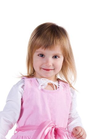 Cute little girl in a pink. Studio shotの写真素材