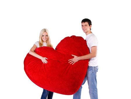 Loving couple with a big heart on white backgroundの写真素材