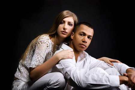Beautiful couple isolated on a black backgroundの写真素材