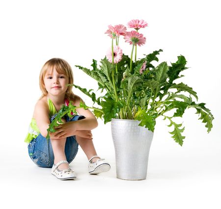 Cute little girl with the wlowers. Studio shotの写真素材