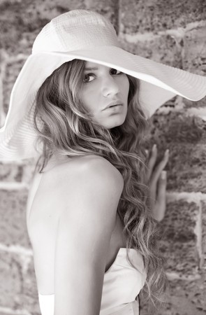 Beautiful young women near the wall. Black-and-whiteの写真素材