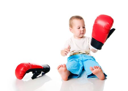 Cute little boy with the boxing glovesの写真素材
