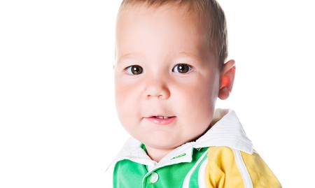 Cute little boy close-up on white background の写真素材