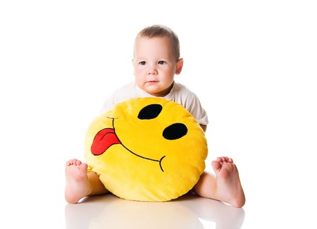 Cute little boy with the smiley on white background の写真素材