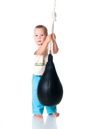 Cute little boy with the punching bagの写真素材